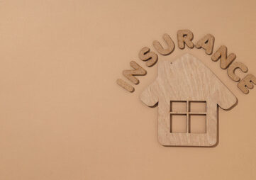 Wooden house and the word Insurance